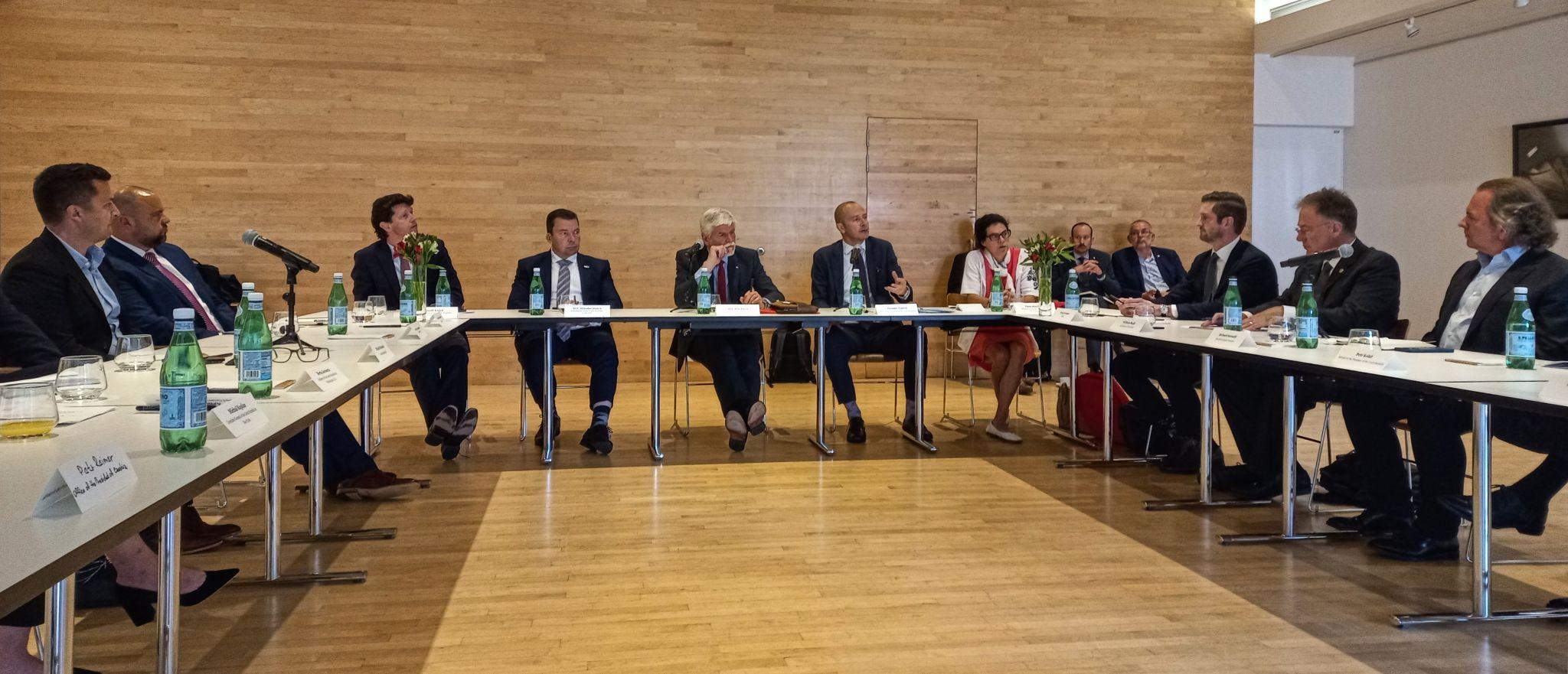 Members meet in a round table discussion